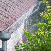 gutters overflowing red roof